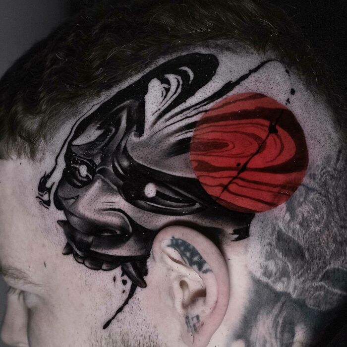 Black And Red ink tattoo on head