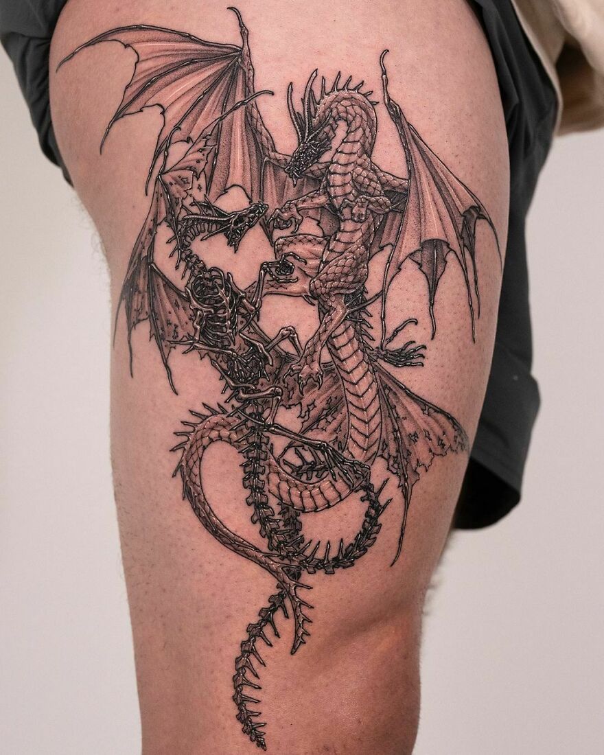 tattoo of two dragons of life and death on thighs