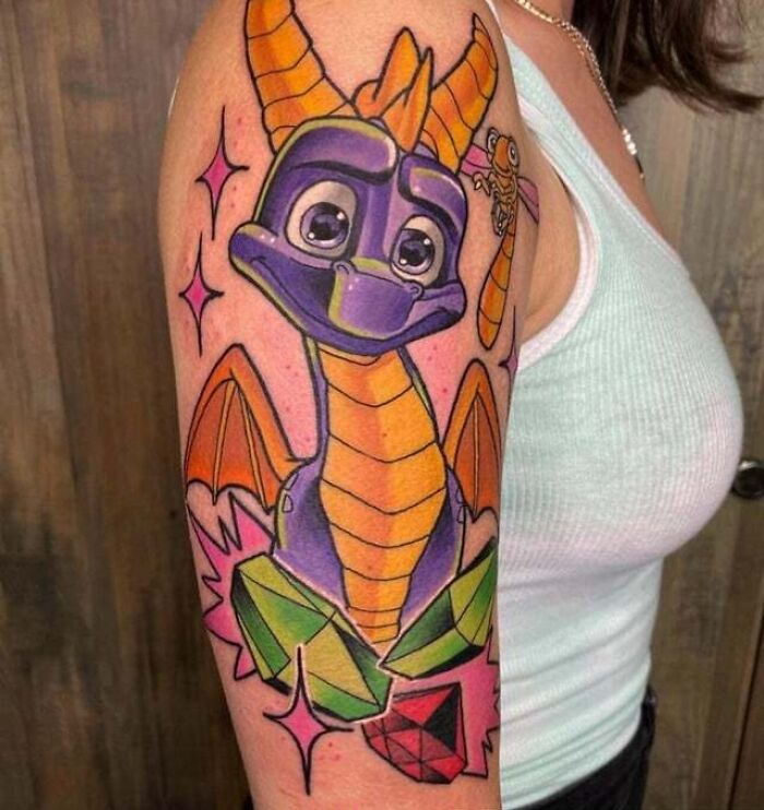 colorful Spyro And Sparx Boy arm Tattoo