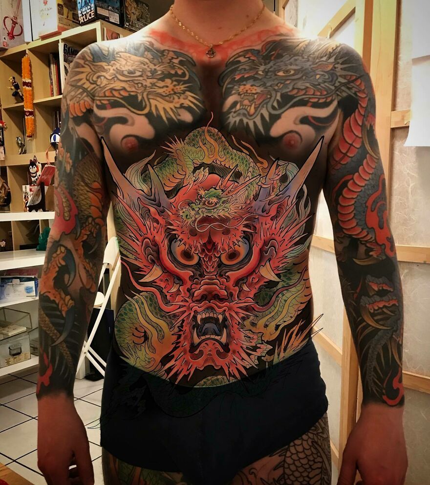 A Full Body Tattoo Of A Dragon
