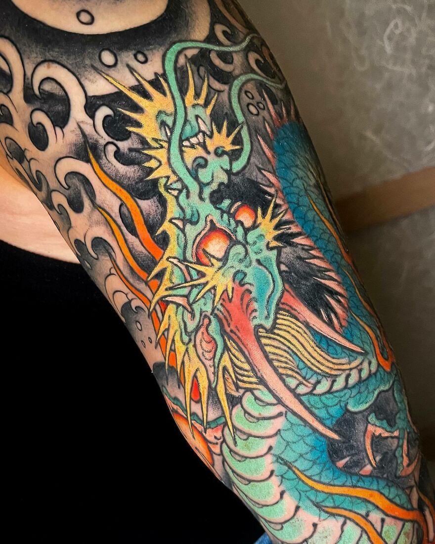 a multicolored dragon tattoo