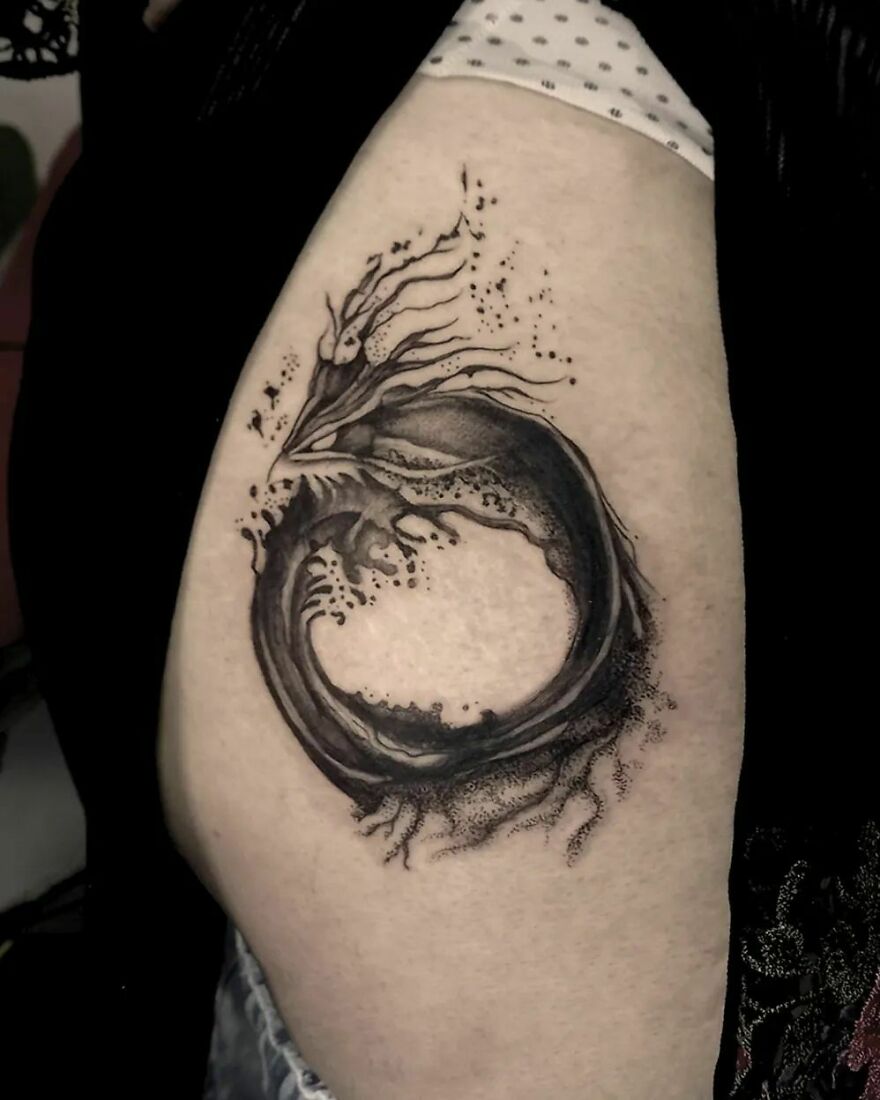 black ink haku dragon tattoo in brushstroke style