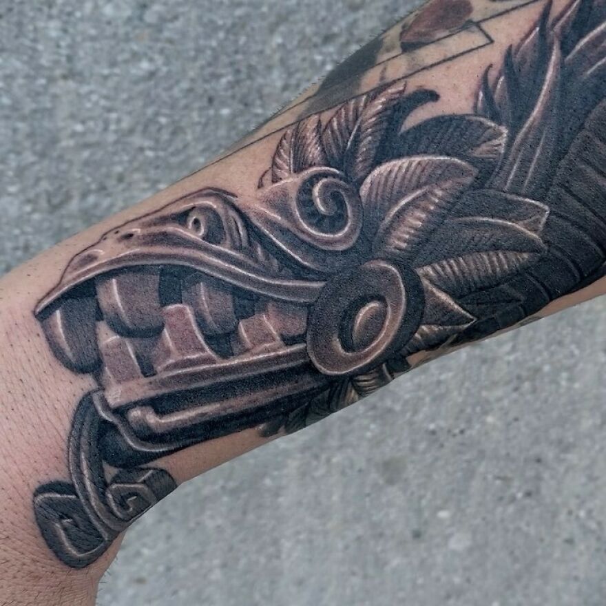 aztec style dragon head tattoo