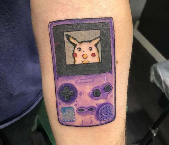 Atomic Purple Gameboy And Pikachu watching arm Tattoo