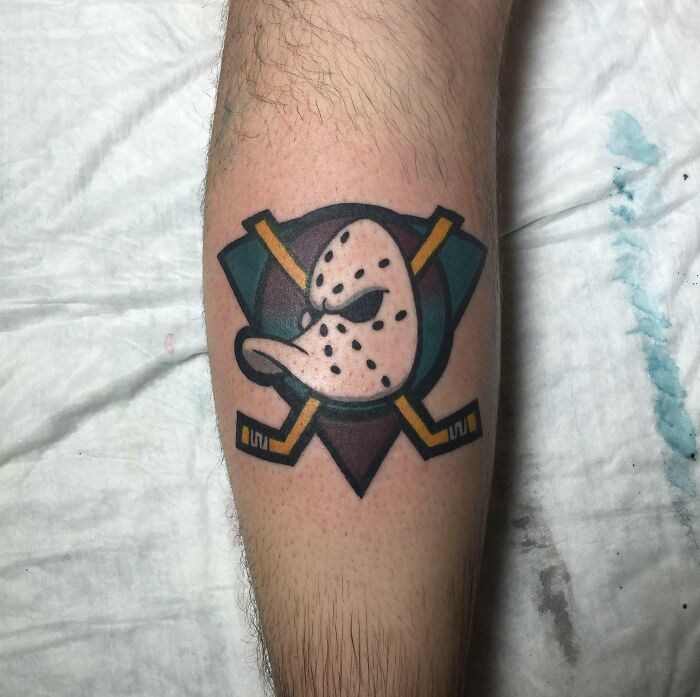 Retro colorful Mighty Ducks Logo arm tattoo