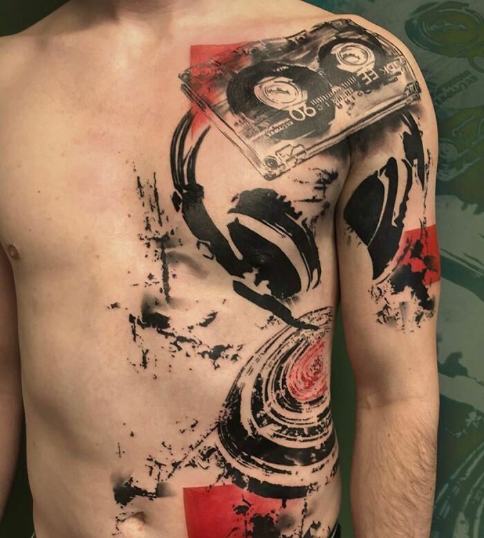 Realistic and abstract music tattoo with headphones and cassette