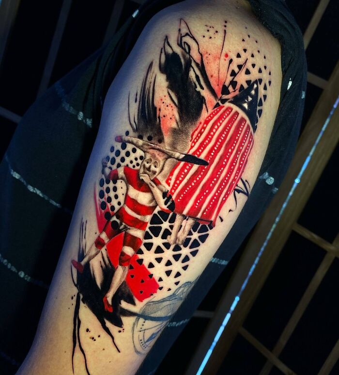 Trash Polka tattoo design featuring abstract patterns and vivid red accents on an arm.