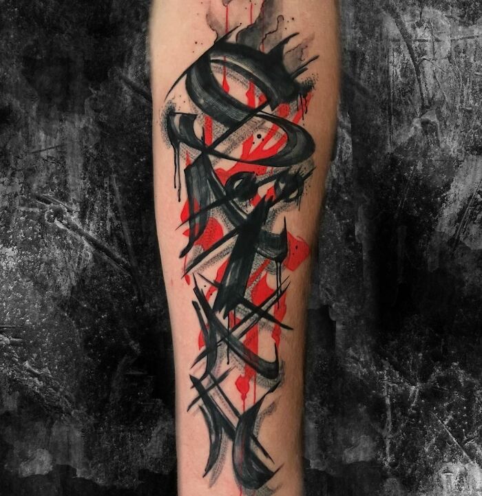 Lettering black and red tattoo