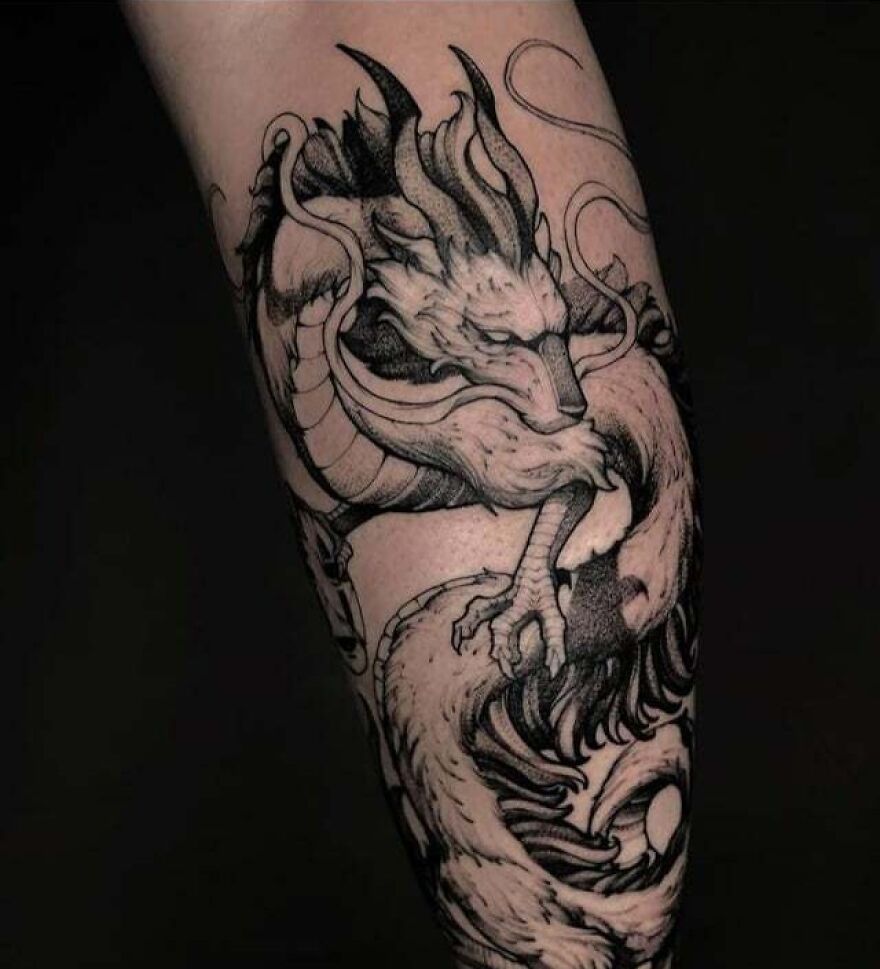 mystic dragon tattoo on forearm