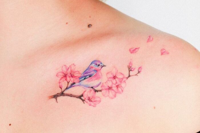 Cherry Blossoms With A Cute Bird collarbone tattoo