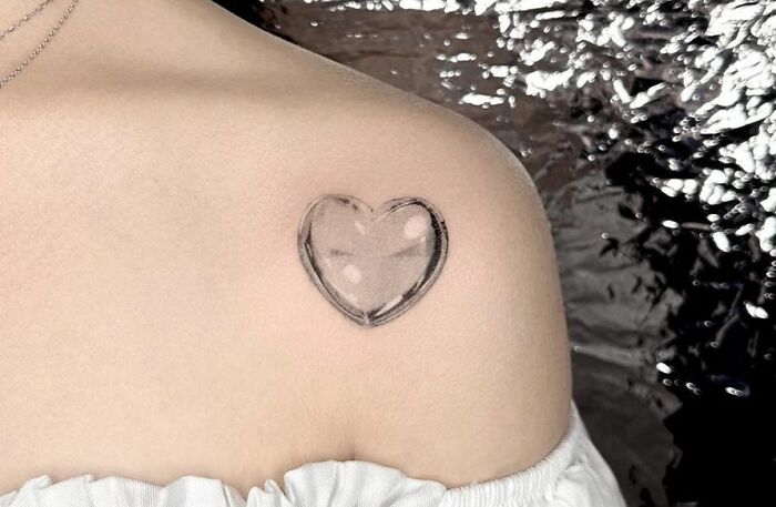 Glass Heart Right Under Collarbone Tattoo