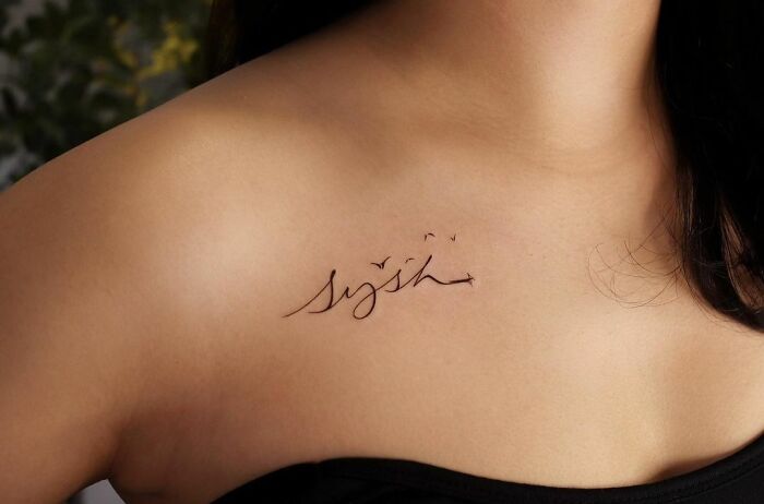 sysh lettering on collarbone tattoo
