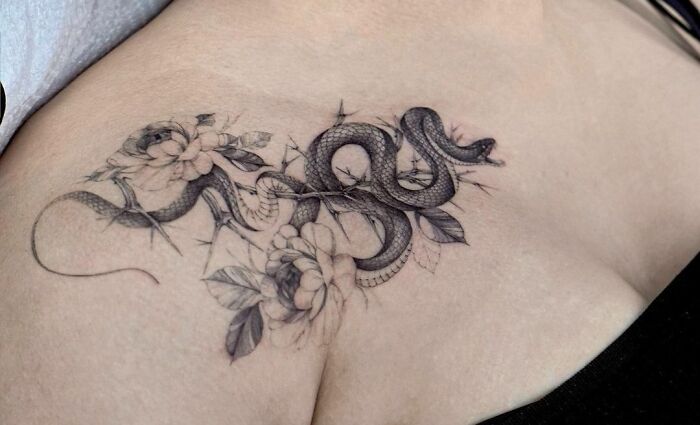 Snake With Thorns collarbone Tattoo