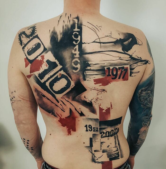 Person with a Trash Polka tattoo covering their back, featuring bold black and red elements and various numbers.