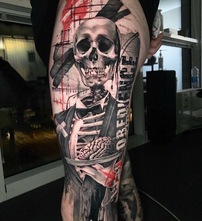 Realistic Trash Polka skeleton and brain tattoo on leg