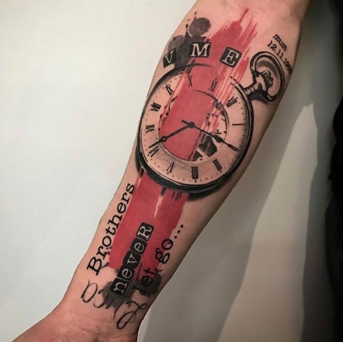 Trash Polka tattoo design featuring a clock and text on a forearm, with bold red and black elements.