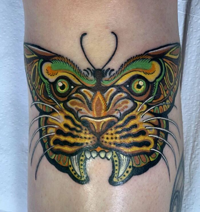 Tiger and a butterfly combined knee tattoo