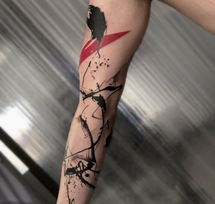 Abstract arm sleeve Trash Polka tattoo