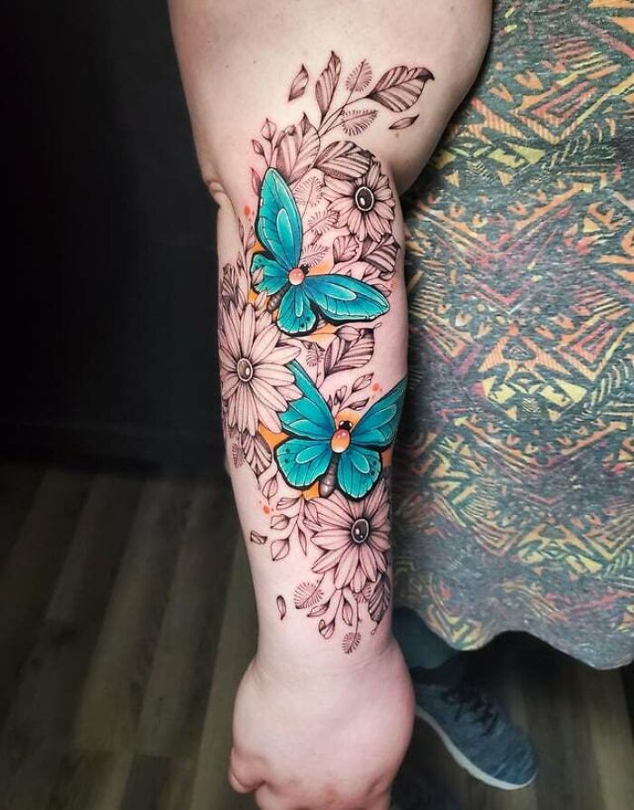 blue Butterflies and flowers arm tattoos