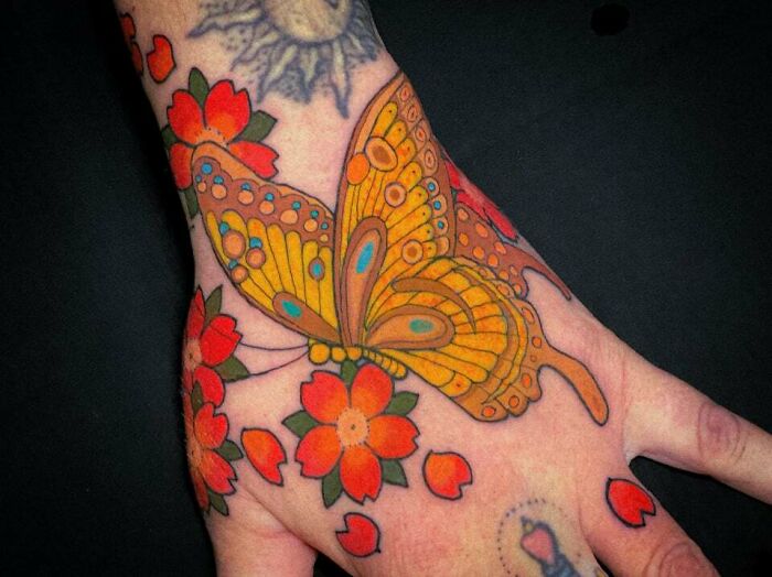 Butterfly And Cherry Blossom Hand Tattoo