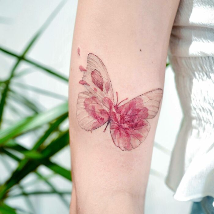 flower butterfly arm tattoo