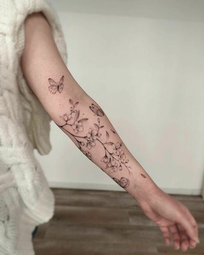 Butterflies With Tree Branches arm Tattoo