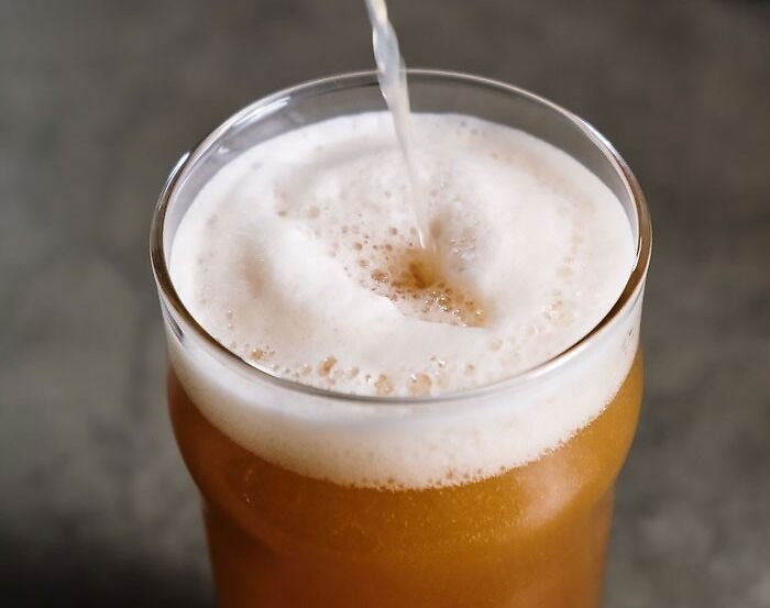 the glass full of beer and milk