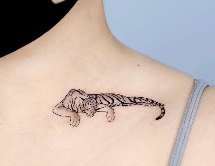 Tiger Sleeping On A Collarbone Tattoo