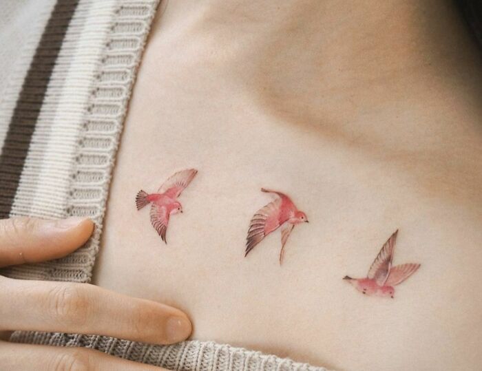 Flying Pink Birds collarbone tattoo