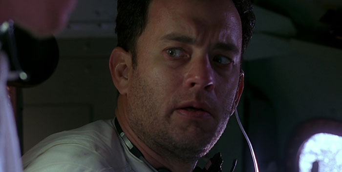 Jim Lovell staring thoughtfully