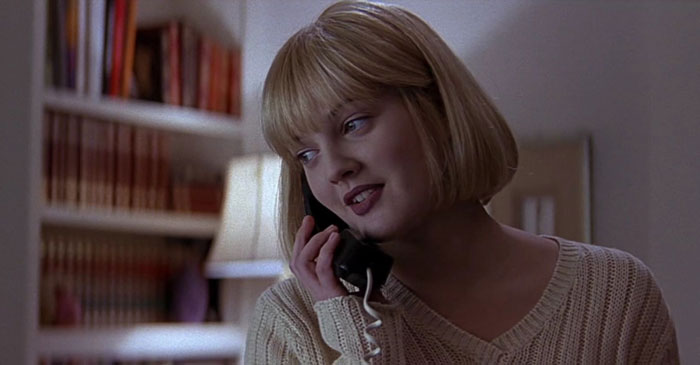 Casey Becker speaking by phone in the room