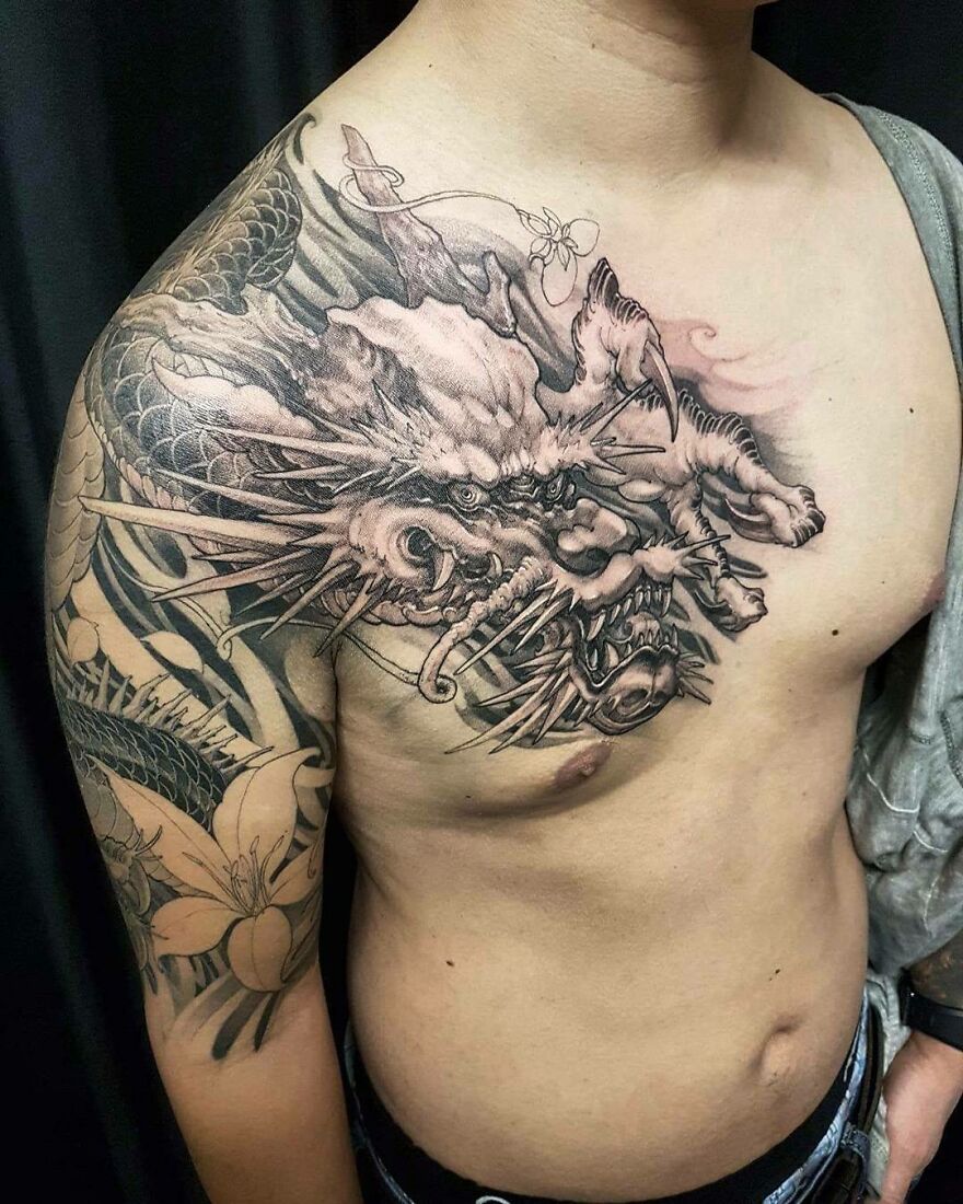 shoulder to chest dragon tattoo design in black ink