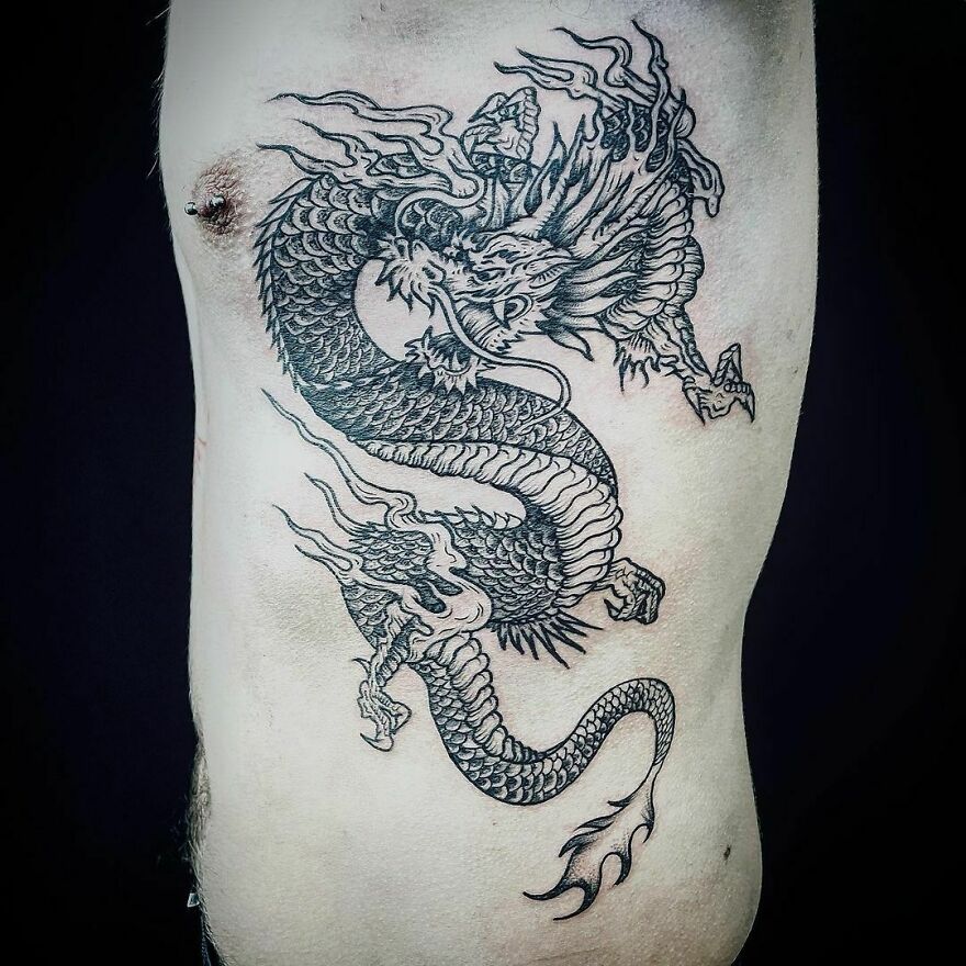  japanese dragon tattoo on obliques in aggressive stance