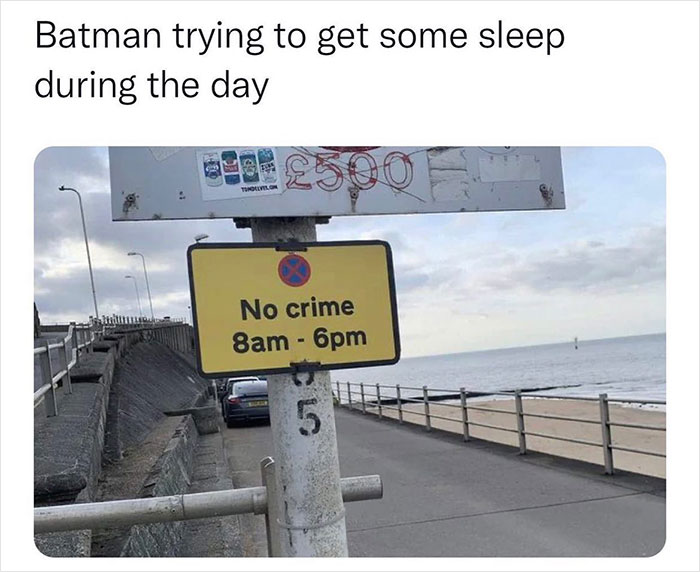 A meme showing a "No crime 8am-6pm" sign on a street, humorously related to Batman's daytime rest.