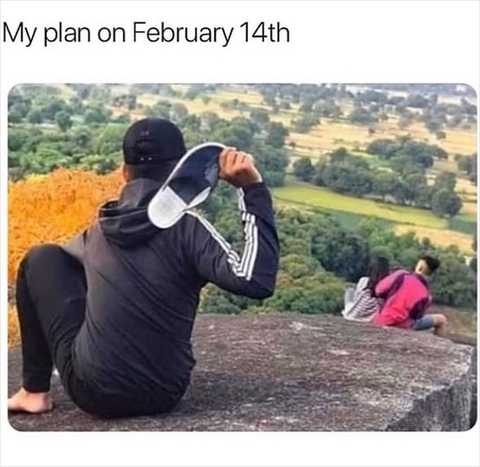 Person holding a sandal, watching a couple on a hill, humorously depicting Valentine's Day plans. Hilarious memes theme.