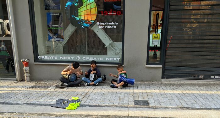 Gipsy Kids Play Tambourine On The Street