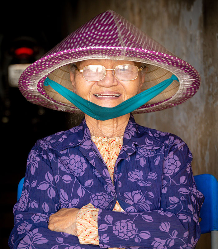 Old woman with hat smiling