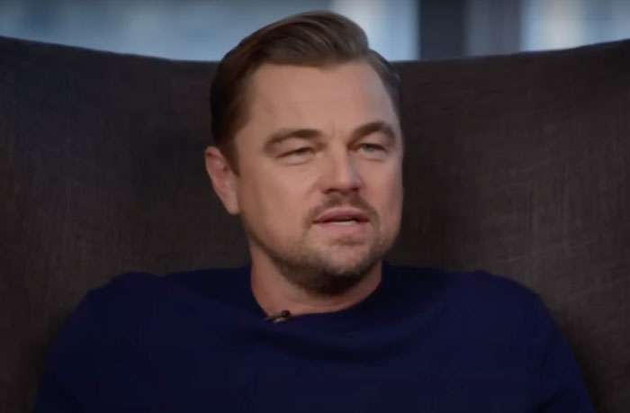 Leonardo DiCaprio sitting on sofa and talking 