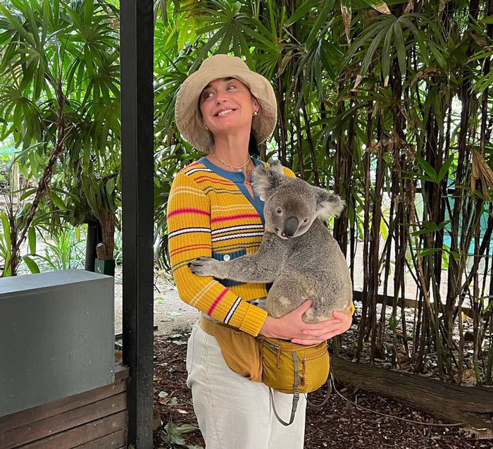 Katy Perry holding a Koala and smiling 