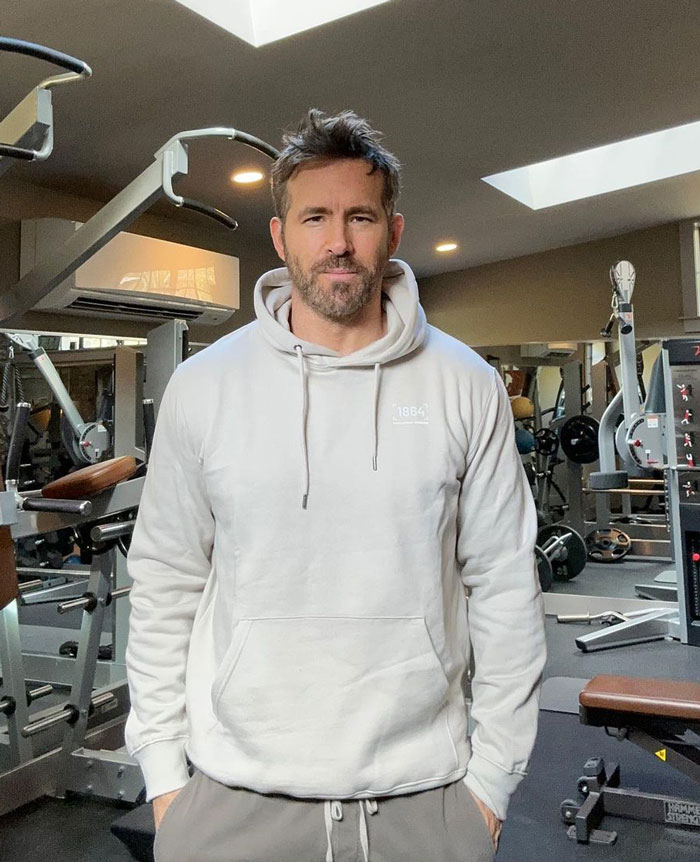 Ryan Reynolds standing in a gym 