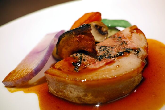Foie Gras With Sauce And Vegetables On Plate 