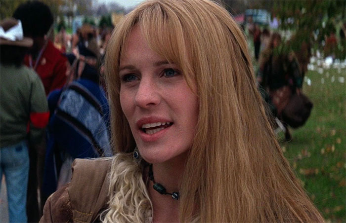 Jenny wearing brown jacket 