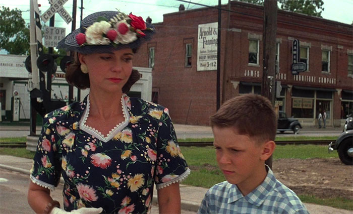 Mrs. Gump and Forrest Gump dressed up 
