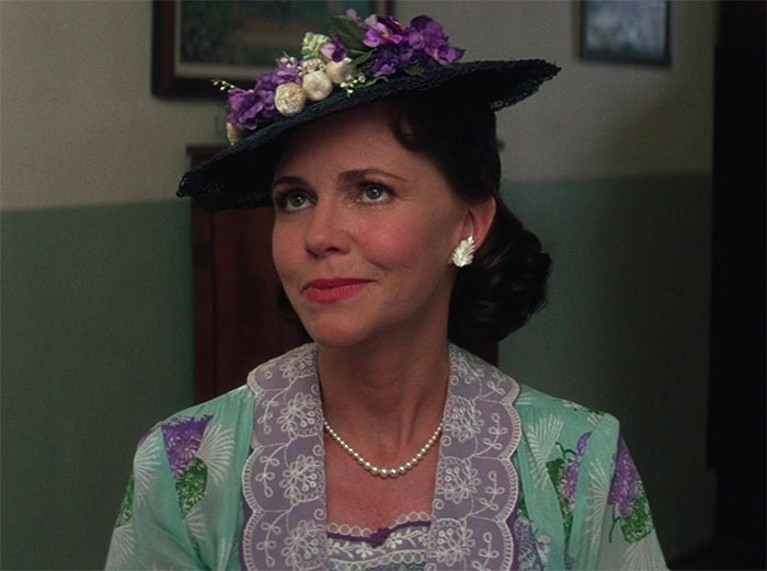 Mrs. Gump wearing a hat with flowers 