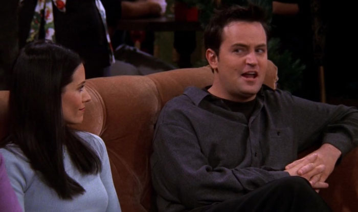 Chandler and Monica on the couch in the coffee house 