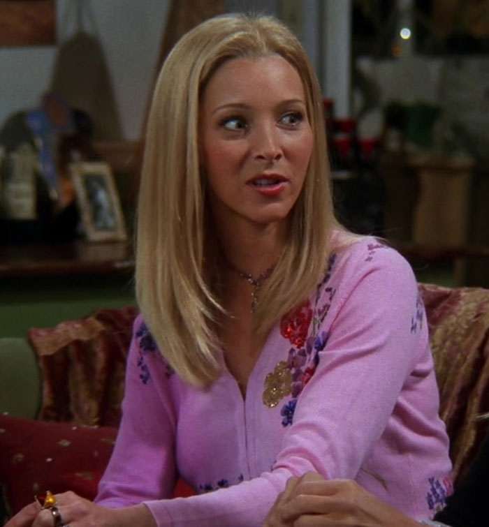 Phoebe wearing pink sweater 