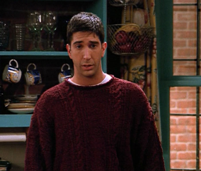Ross wearing red sweater 