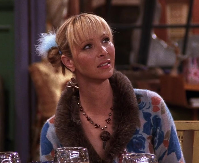 Phoebe wearing sweater with flowers 