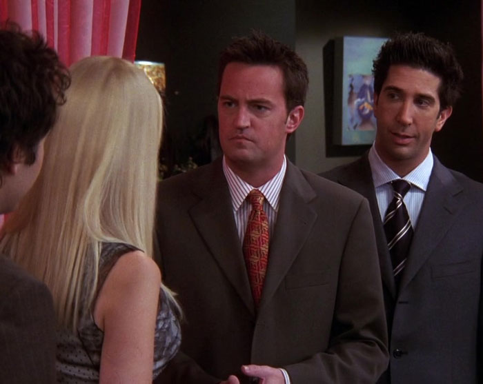 Phoebe and Mike welcoming Chandler and Ross to the rehearsal dinner 