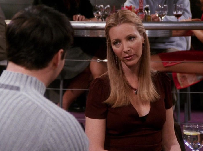 Phoebe talking with joey at the restaurant 